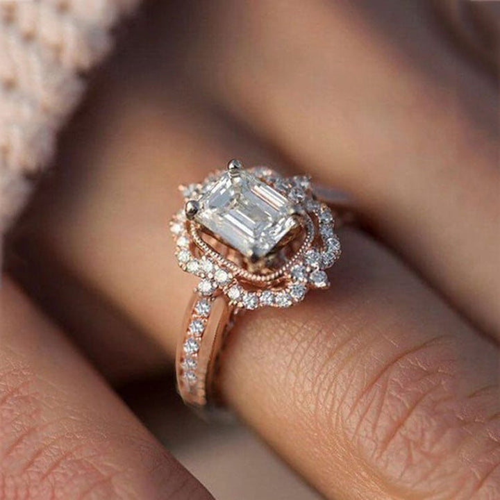 Pierścionek z diamentem o prostokątnym kształcie w halo – nowoczesny błysk i ponadczasowa elegancja
